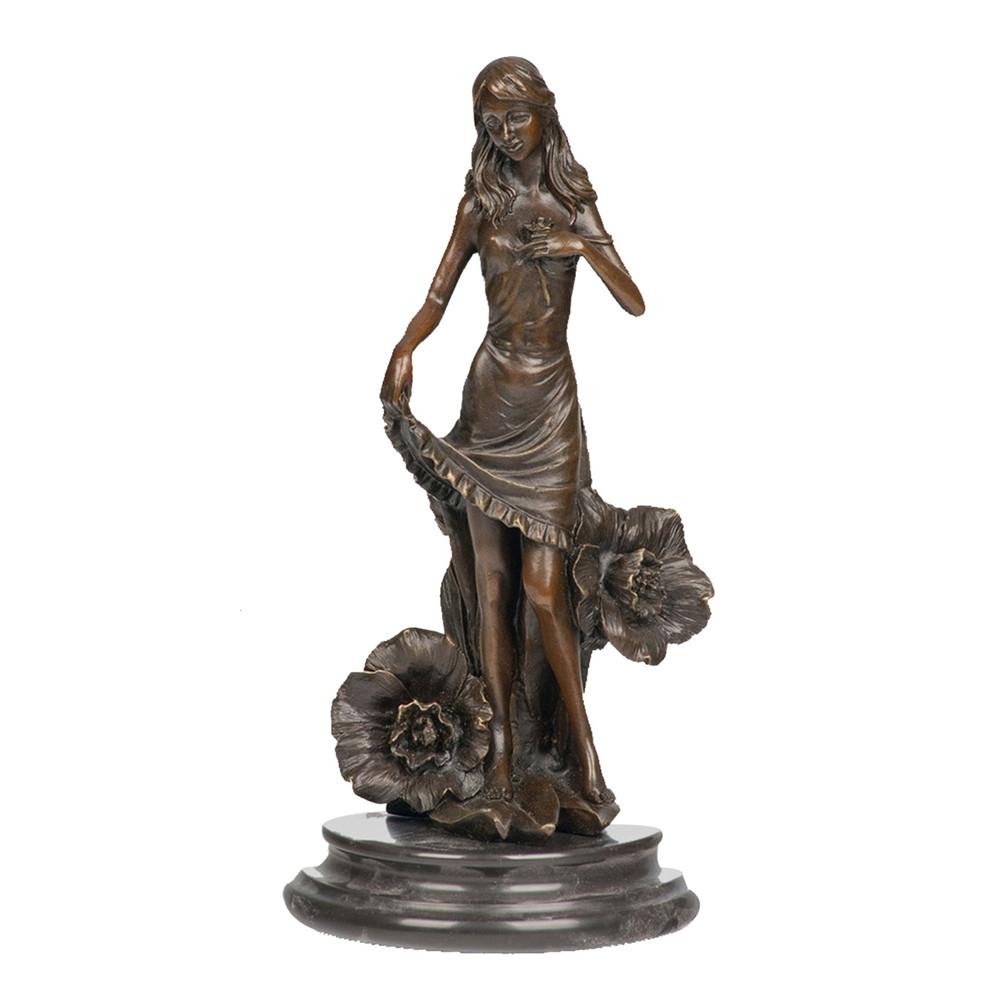 This is a bronze sculpture of a woman. She poses elegantly, lifting her skirt, with delicate and realistic dress textures. Large flowers are decorated around her, and she has a gentle demeanor. The sculpture is mounted on a dark marble base, which contrasts with the bronze body and adds an elegant atmosphere. The overall craftsmanship is exquisite, integrating natural elements in a realistic style, conveying a romantic and gentle artistic atmosphere, and it has high ornamental value.
