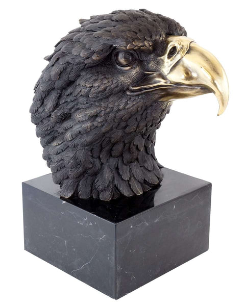 This is a bronze sculpture of an eagle's head. The feather texture is delicate and realistic, the golden beak is sharp and textured, and the eyes are sharp and vivid. The sculpture is mounted on a black marble base with a regular shape, which contrasts with the bronze eagle's head in texture, adding a solemn and elegant atmosphere. The overall craftsmanship is exquisite, vividly presenting the eagle's majesty and sense of power, and it has high artistic appreciation.