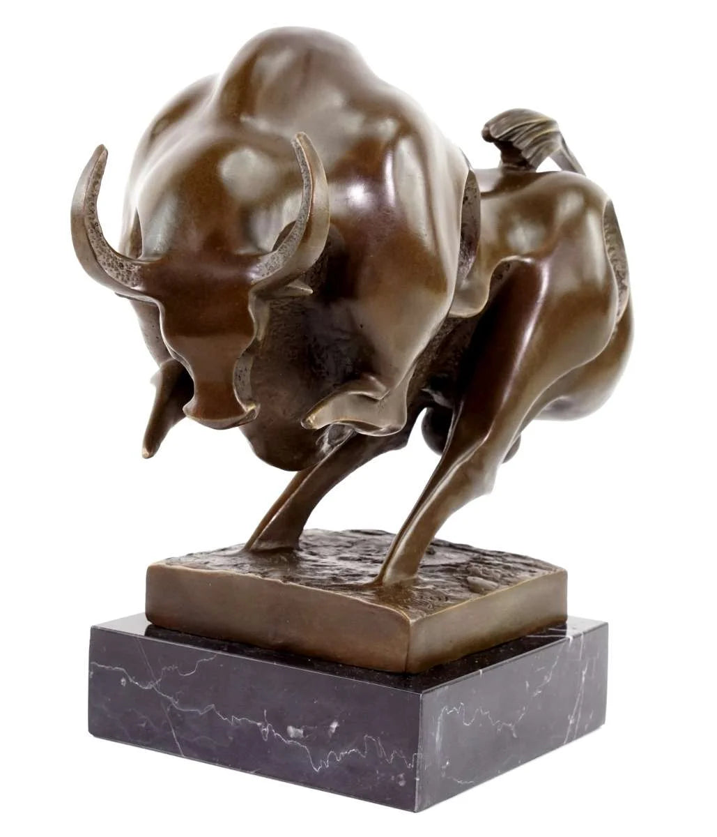 Bronze sculpture of a charging bull on a marble base
