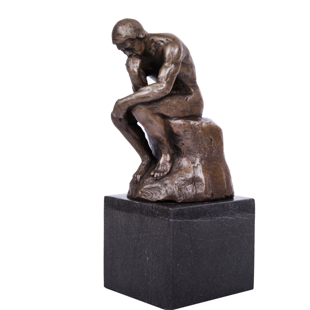 This is a bronze sculpture of Auguste Rodin’s classic work The Thinker, made of bronze and paired with a dark marble base. The sculpture depicts a nude male figure in a seated posture, leaning forward with one hand resting on his chin. The muscle lines and body contours are rendered in a rough yet powerful style, and the solemn, focused demeanor accurately conveys a sense of profound contemplation. 