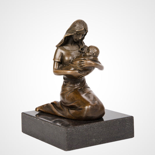 This is a bronze mother-child sculpture: a kneeling woman holds a baby, mounted on a black stone base. With gentle styling, it’s a family-themed decor piece conveying maternal love and warmth.