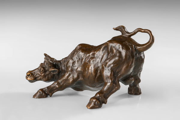 Wall Street charging bull bronze sculpture in a powerful pose, realistic bull market statue on black marble base, loss wax casting fine art.