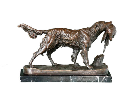 This is a bronze sculpture of a hunting dog. The hunting dog is in a dynamic walking posture, holding prey in its mouth. Its fur texture is delicate and realistic, and the muscle lines are full of power. The sculpture is mounted on a black marble base with natural veins, which not only provides stable support but also forms a contrast with the texture of the bronze hunting dog, enhancing the realism of the scene. 