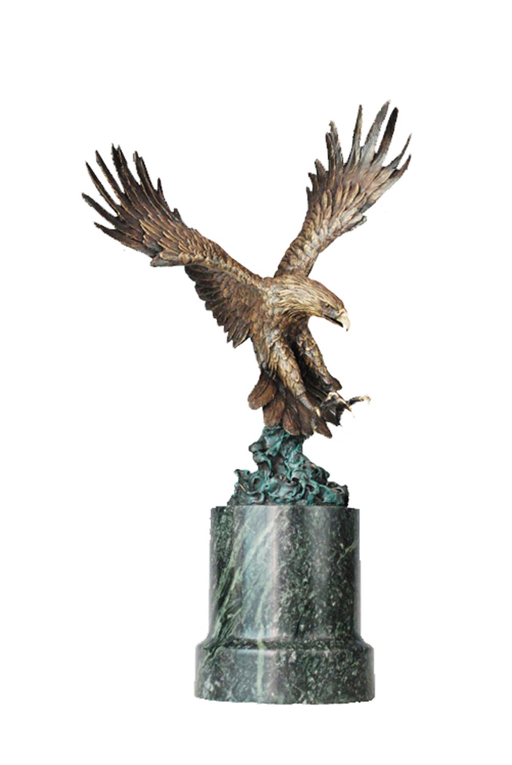 This is a sculpture of an eagle. It is made of bronze, depicting an eagle in a dynamic diving posture with its wings widely spread. The feathers are exquisitely detailed, looking remarkably realistic. The eagle has a sharp expression, and its claws are slightly open, full of a sense of power and aggressiveness, as if it is about to hunt.