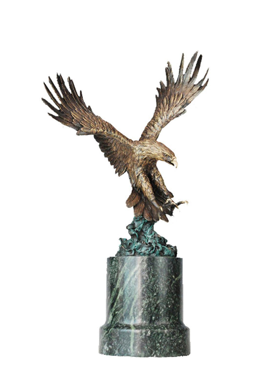 This is a sculpture of an eagle. It is made of bronze, depicting an eagle in a dynamic diving posture with its wings widely spread. The feathers are exquisitely detailed, looking remarkably realistic. The eagle has a sharp expression, and its claws are slightly open, full of a sense of power and aggressiveness, as if it is about to hunt.
