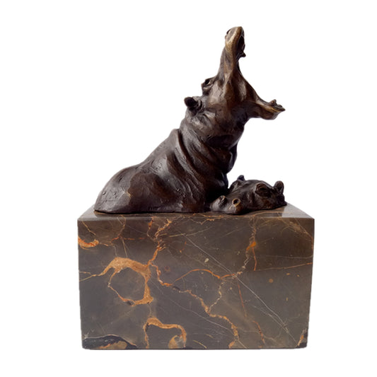 This is a bronze hippopotamus sculpture: The adult hippo tilts its head back with an open jaw, a dynamic posture; a calf nestles beside it, showing intimacy. The sculpture has a dark brown metallic texture, paired with a dark marble base with golden veins, vividly conveying the interaction between the hippo parent and calf.
