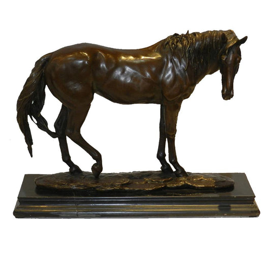 This is a bronze horse sculpture. The horse is in a standing posture, with its head slightly lowered. The textures of its mane and tail are exquisitely realistic, and the smooth and textured muscle lines fully demonstrate the horse’s strength and elegance.